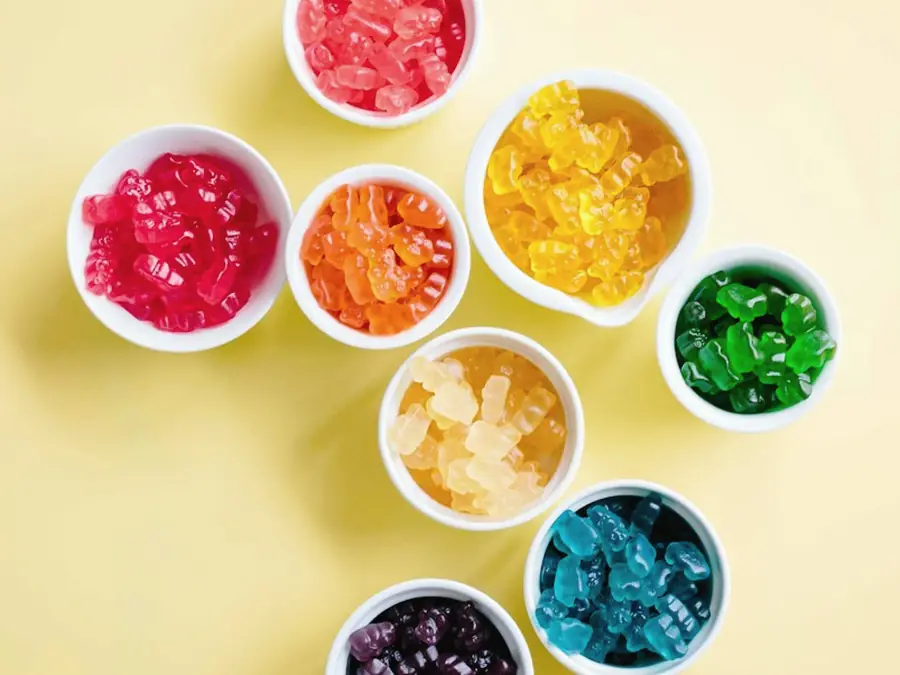 Small cups of brightly coloured gummy sweets
