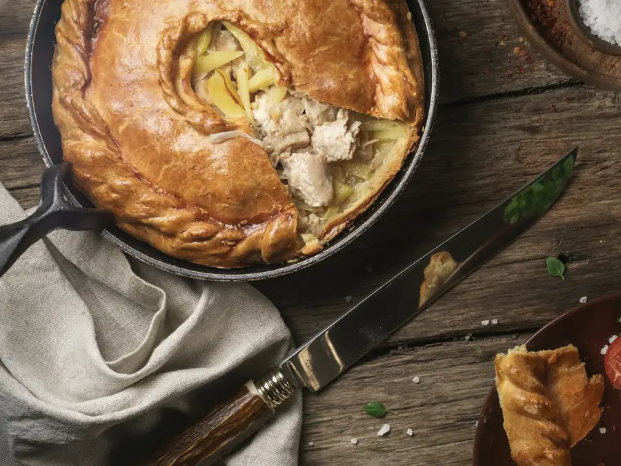 A chicken pie cut open to show its filling
